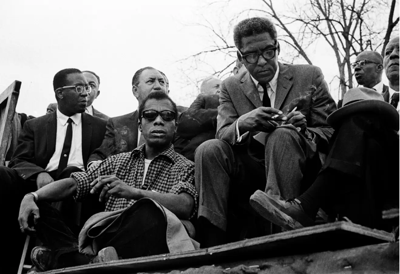 James Baldwin with Rustin, photo described above
